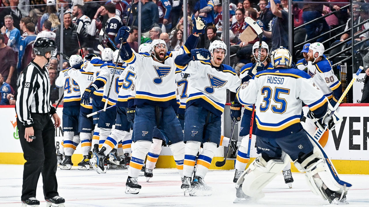 DENVER, CO - MAY 25: St. Louis Blues players celebrate an overtime win with St. Louis Blues goaltender Ville Husso (35) during a Stanley Cup Playoffs round 2 game between the St. Louis Blues and the Colorado Avalanche at Ball Arena in Denver, Colorado on May 25, 2022.