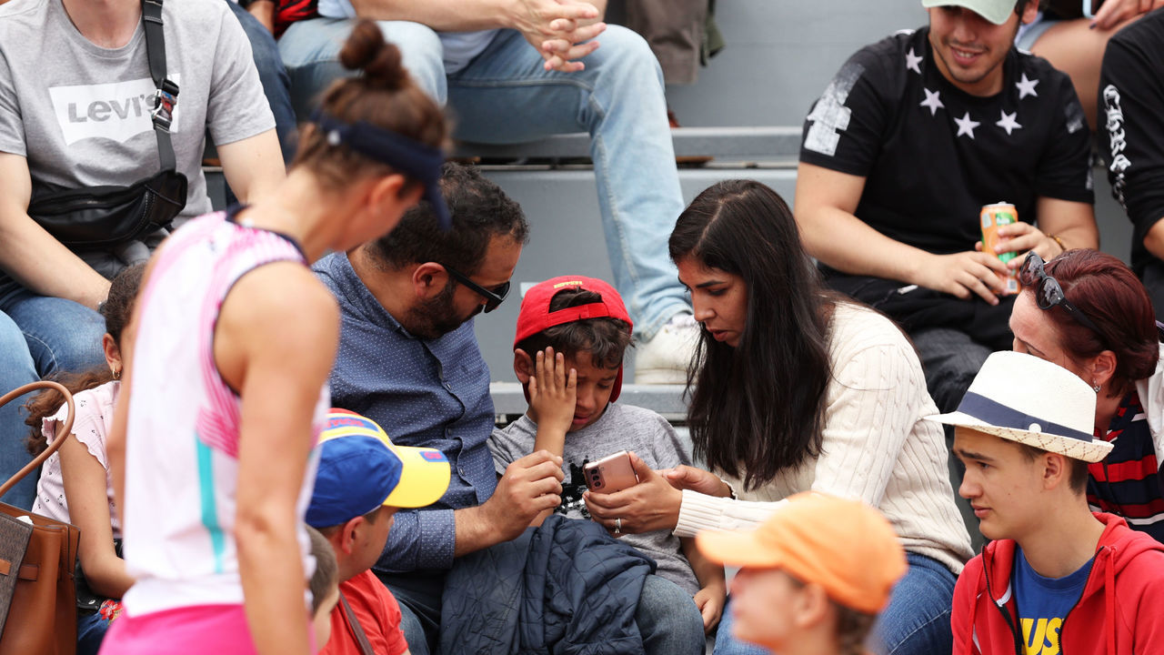 PARIS, FRANCE - MAY 26: Irina-Camelia Begu of Romania checks on a child she struck in the face with a ball during the Women's singles Second Round on Day Five of the 2022 French Open at Roland Garros on May 26, 2022 in Paris, France.