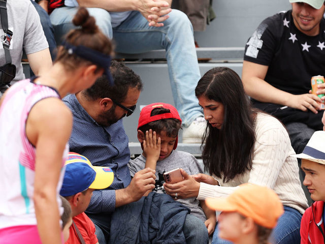 PARIS, FRANCE - MAY 26: Irina-Camelia Begu of Romania checks on a child she struck in the face with a ball during the Women's singles Second Round on Day Five of the 2022 French Open at Roland Garros on May 26, 2022 in Paris, France.