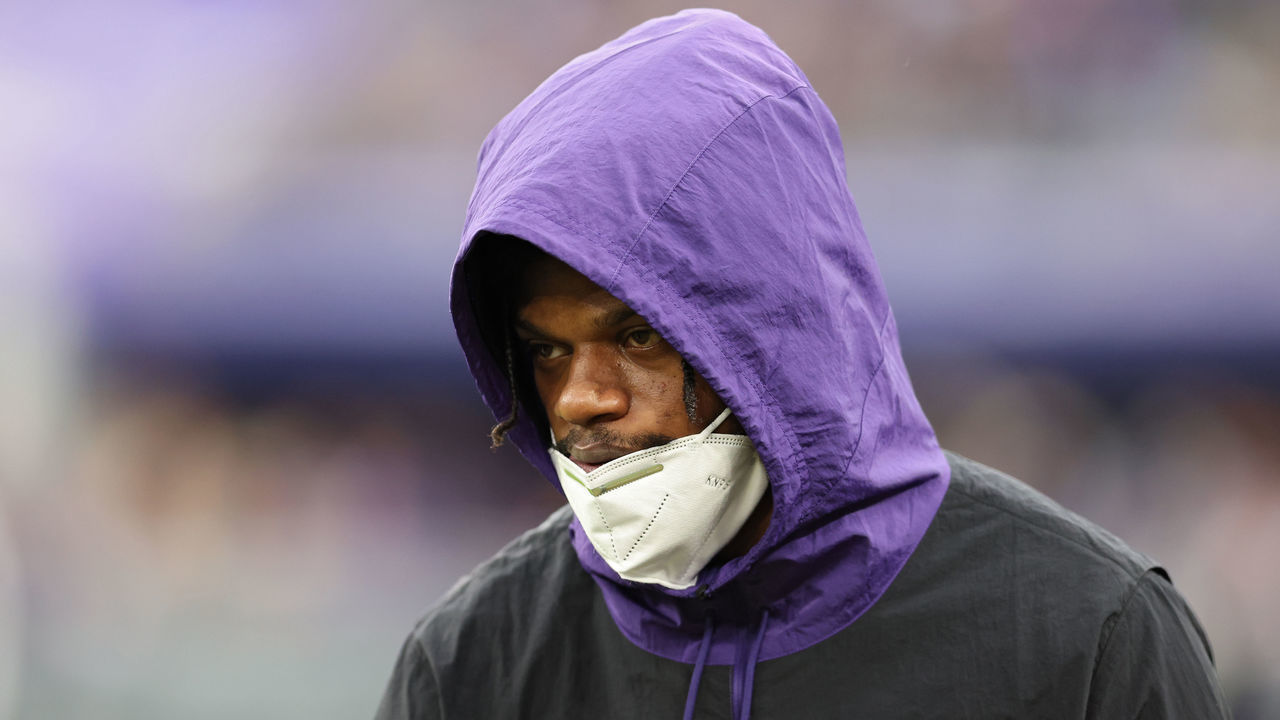 BALTIMORE, MARYLAND - JANUARY 02: Lamar Jackson #8 of the Baltimore Ravens looks on from the sidelines in the third quarter of the game against the Los Angeles Rams at M&T Bank Stadium on January 02, 2022 in Baltimore, Maryland.