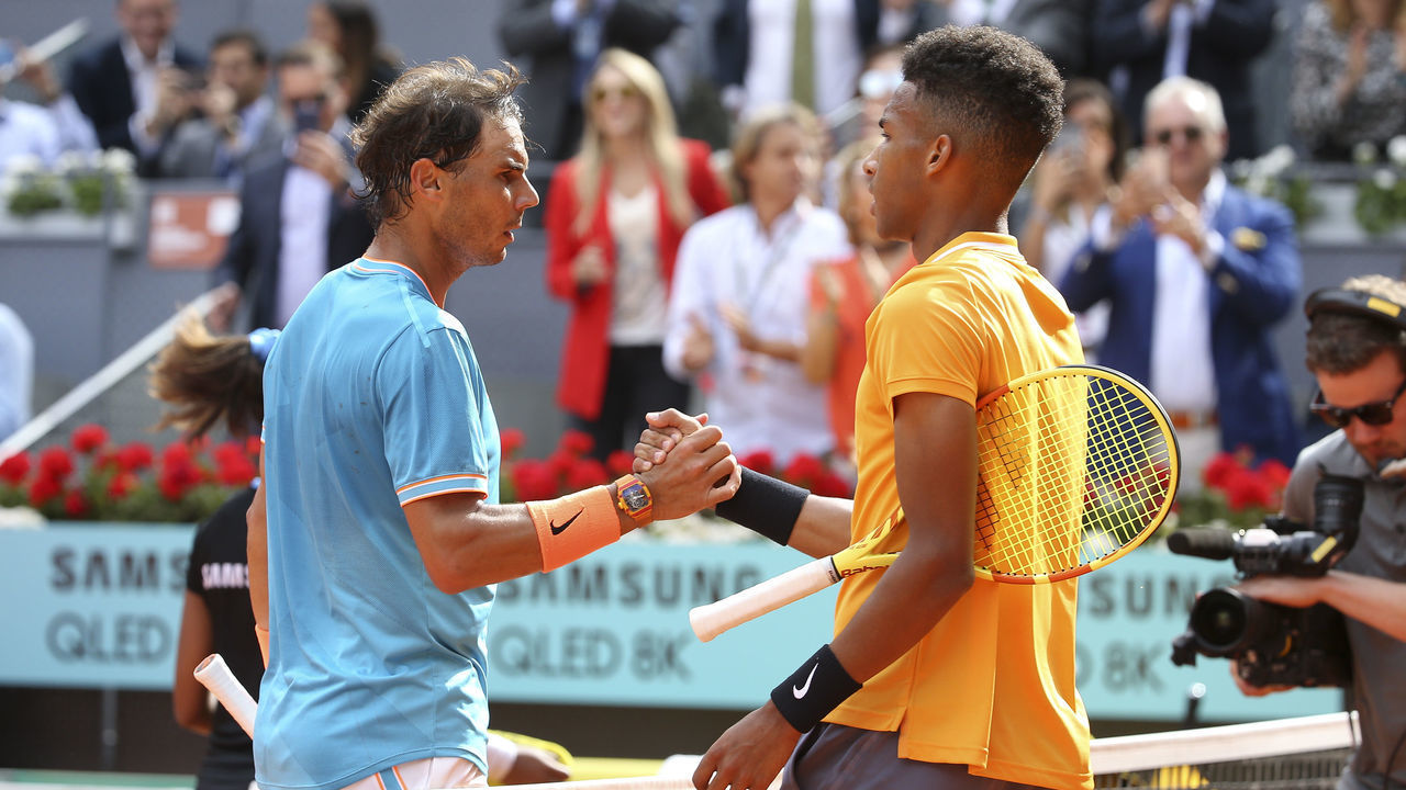 MADRID, SPAIN - MAY 8: Rafael Nadal of Spain shakes hands with Felix Auger-Aliassime of Canada after beating him on day 5 of the Mutua Madrid Open at La Caja Magica on May 8, 2019 in Madrid, Spain.