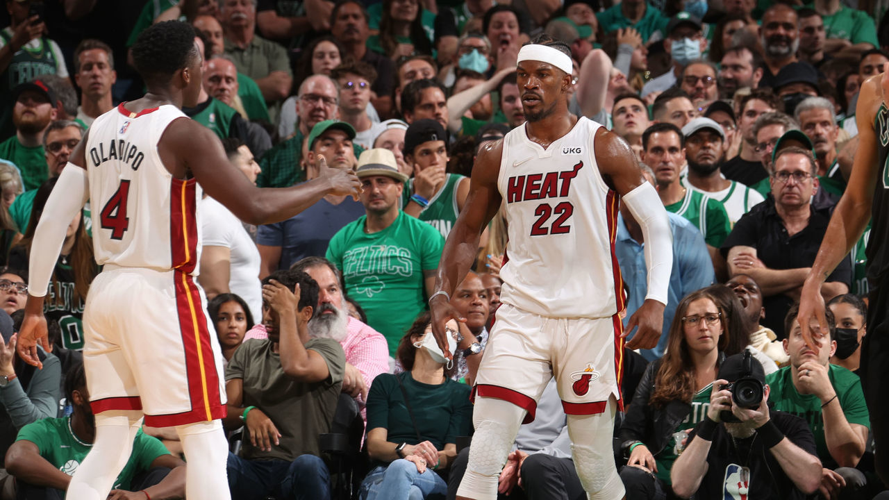 BOSTON, MA - MAY 27: Victor Oladipo #4 hi-fives Jimmy Butler #22 of the Miami Heat during Game 6 of the 2022 NBA Playoffs Eastern Conference Finals on May 27, 2022 at the TD Garden in Boston, Massachusetts. Mandatory Copyright Notice: Copyright 2022 NBAE