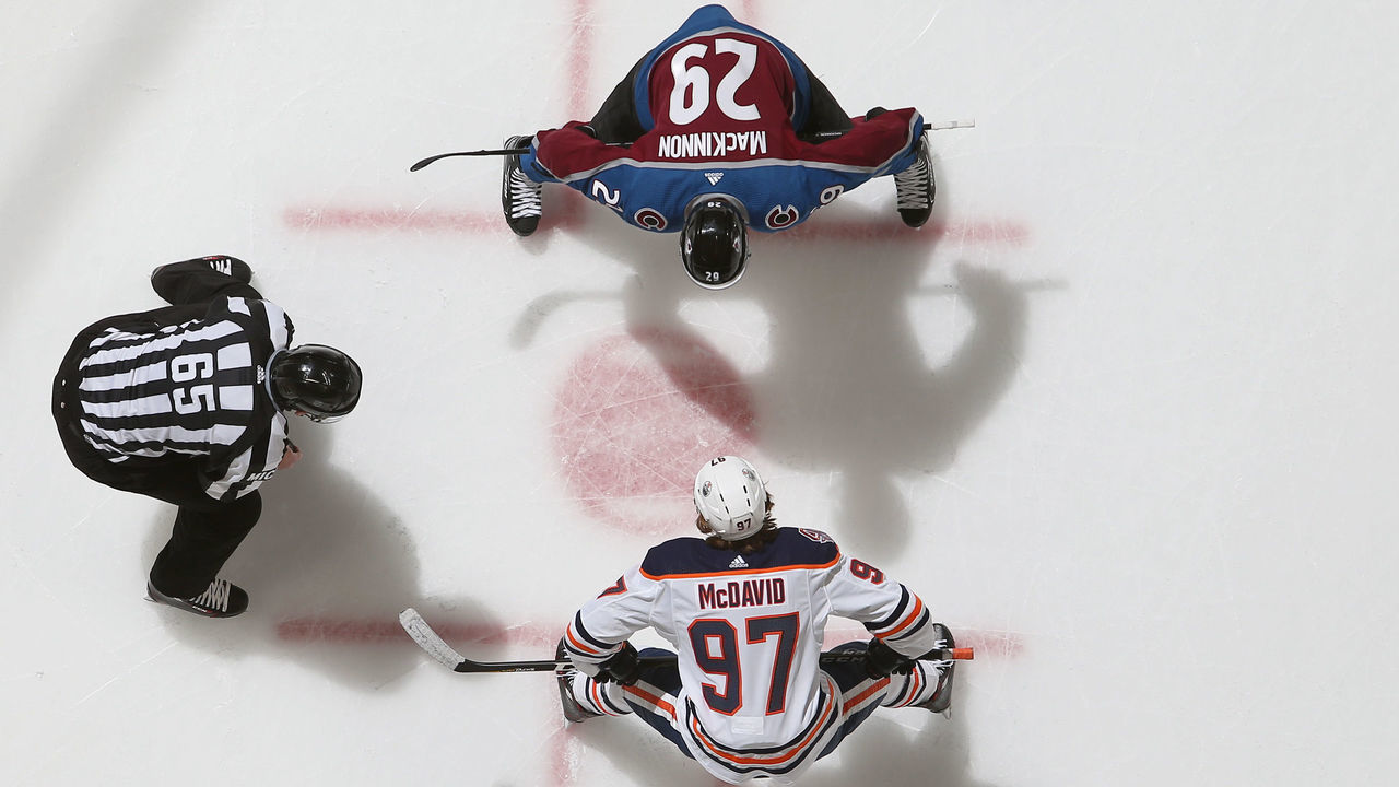 DENVER, CO - DECEMBER 11: Nathan MacKinnon #29 of the Colorado Avalanche faces off against Connor McDavid #97 of the Edmonton Oilers at the Pepsi Center on December 11, 2018 in Denver, Colorado. The Oilers defeated the Avalanche 6-4.