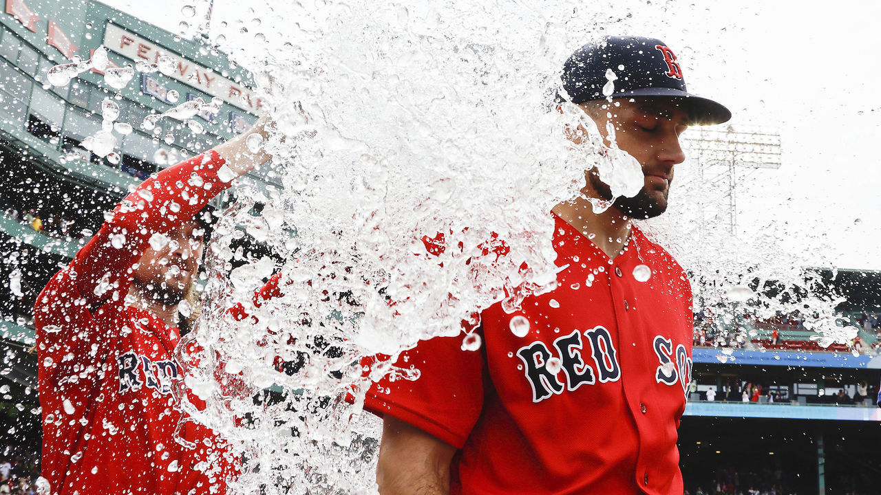 BOSTON, MA - MAY 28: Starting pitcher Nathan Eovaldi #17 of the Boston Red Sox gets water dumped on him after pitching a complete game in their 5-3 win over the Baltimore Orioles in game one of a doubleheader at Fenway Park on May 28, 2022 in Boston, Massachusetts.