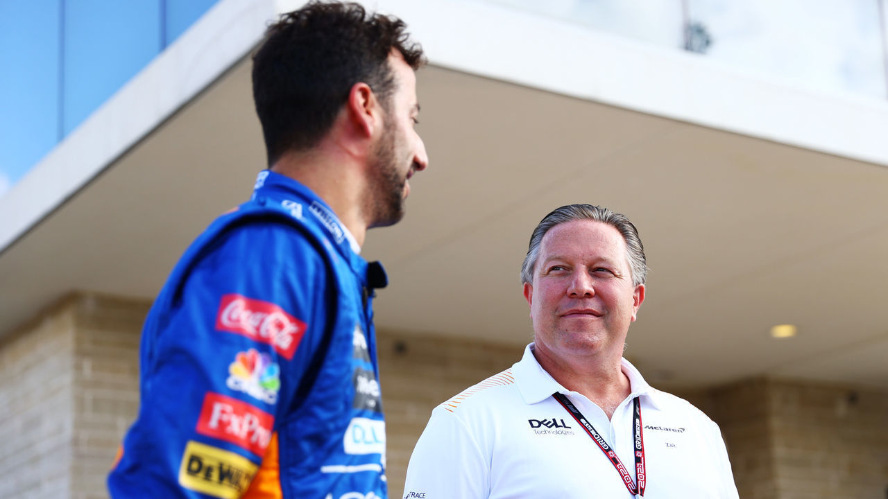 AUSTIN, TEXAS - OCTOBER 23: Daniel Ricciardo of Australia and McLaren F1 poses for a photo with McLaren Chief Executive Officer Zak Brown before a showrun in Dale Earnhardt Sr's 1984 Wrangler Chevrolet Monte Carlo NASCAR before final practice ahead of the F1 Grand Prix of USA at Circuit of The Americas on October 23, 2021 in Austin, Texas.