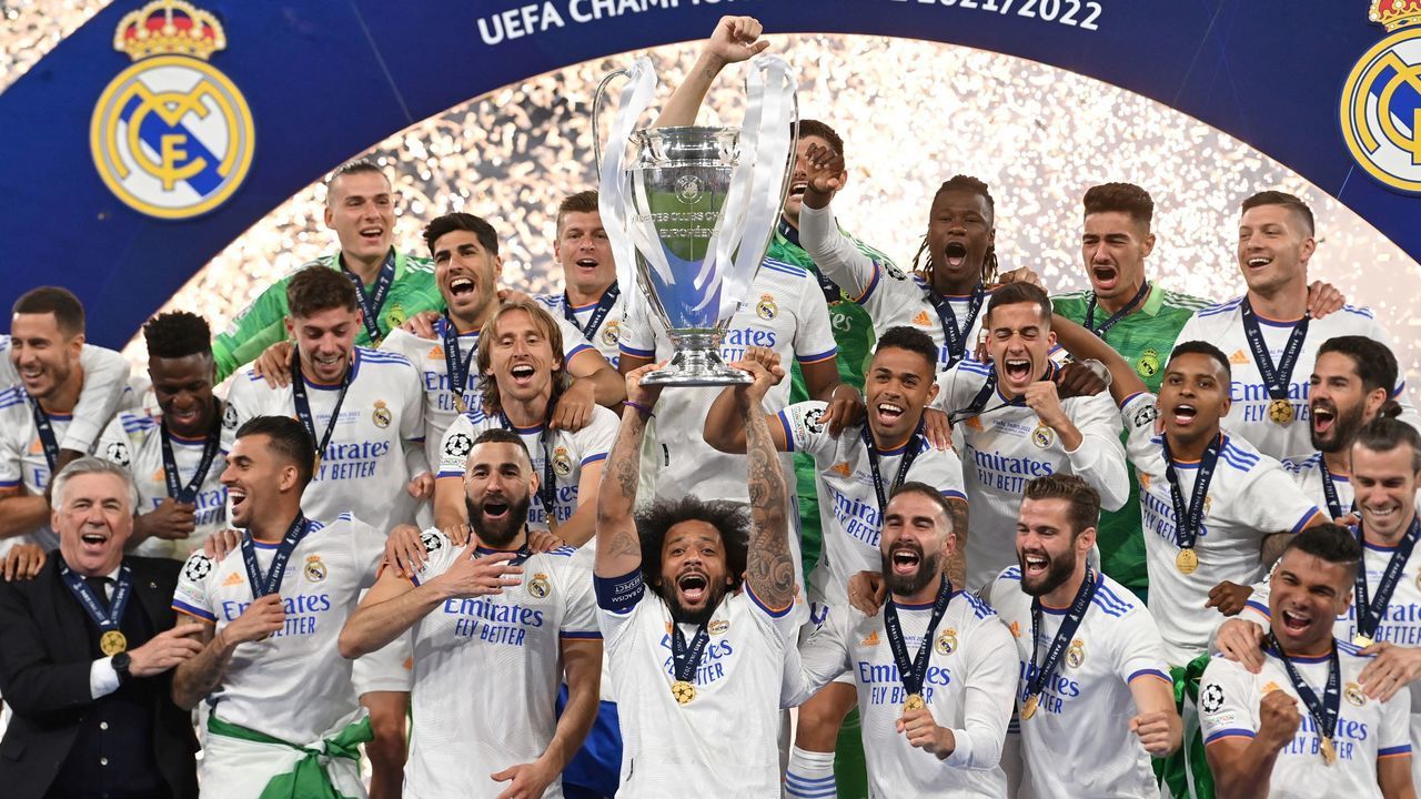 Real Madrid's Brazilian defender Marcelo lifts the Champions League trophy after Madrid 's victory in the UEFA Champions League final football match between Liverpool and Real Madrid at the Stade de France in Saint-Denis, north of Paris, on May 28, 2022.