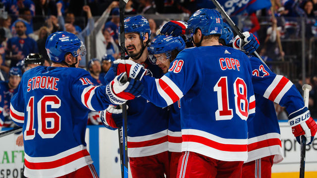 NEW YORK, NEW YORK - MAY 28: Artemi Panarin #10 of the New York Rangers is surrounded by teammates after scoring a goal during the third period of a game against the Carolina Hurricanes in Game Six of the Second Round of the 2022 Stanley Cup Playoffs at Madison Square Garden on May 28, 2022 in New York City.
