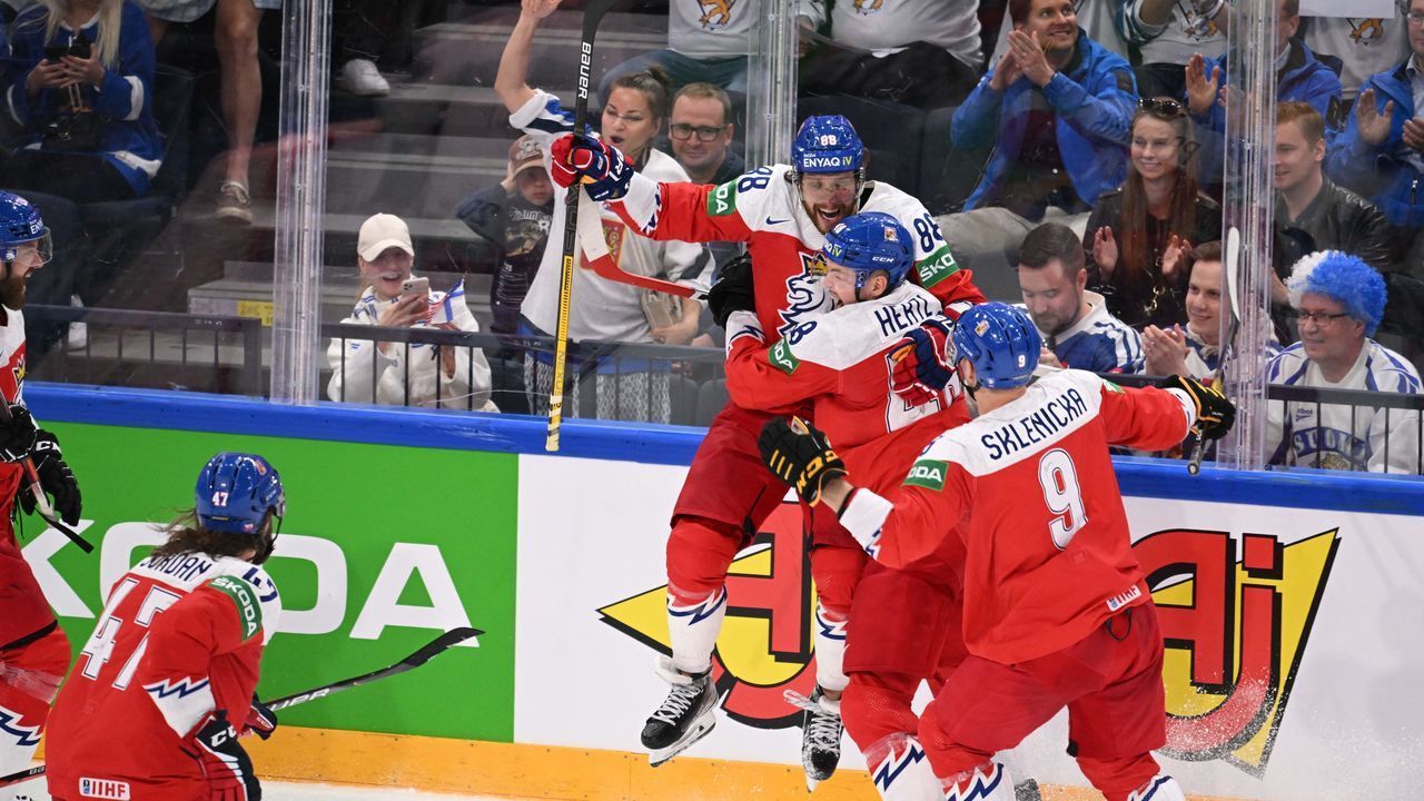 Czech Republic's forward David Pastrnak (C Up) celebrates his 5-3 goal during the IIHF Ice Hockey World Championships third place play-off match between Czech Republic and USA in Tampere, Finland, on May 29, 2022.