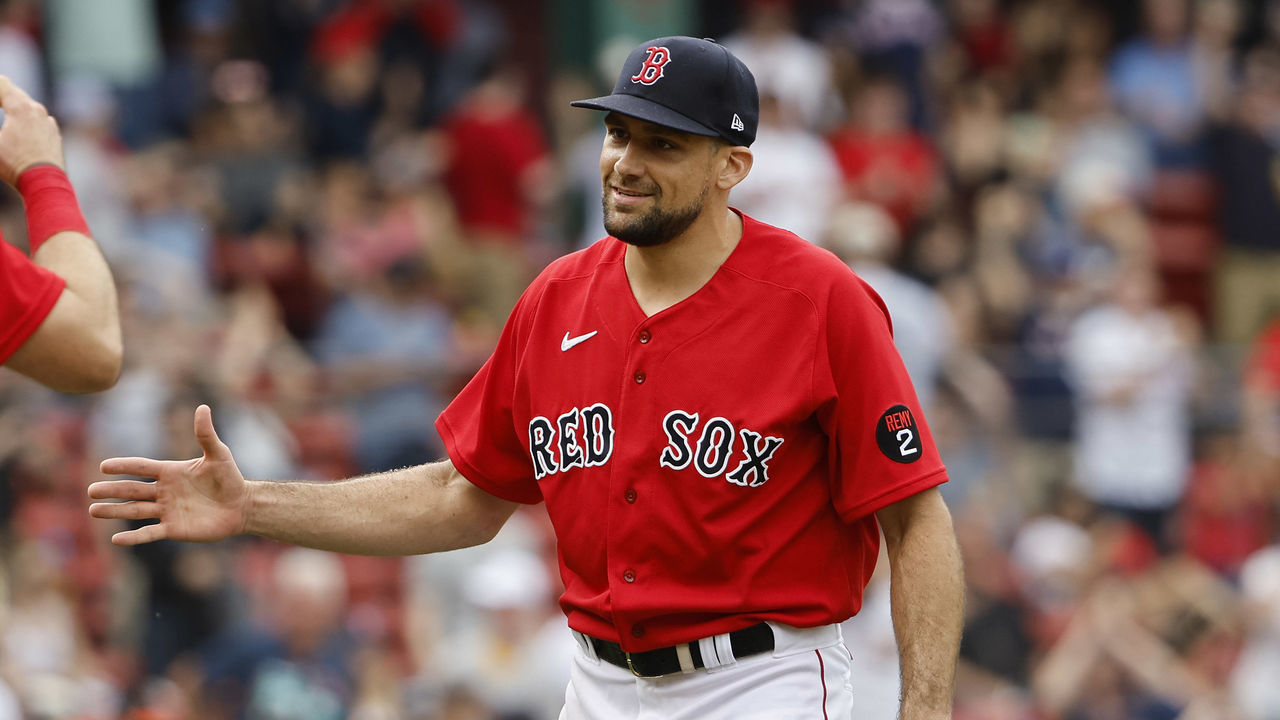 BOSTON, MA - MAY 28: Catcher Kevin Plawecki #25 of the Boston Red Sox moves in to congratulate pitcher Nathan Eovaldi #17 of the Boston Red Sox after their 5-3 win over the Baltimore Orioles in game one of a doubleheader at Fenway Park on May 28, 2022 in Boston, Massachusetts.
