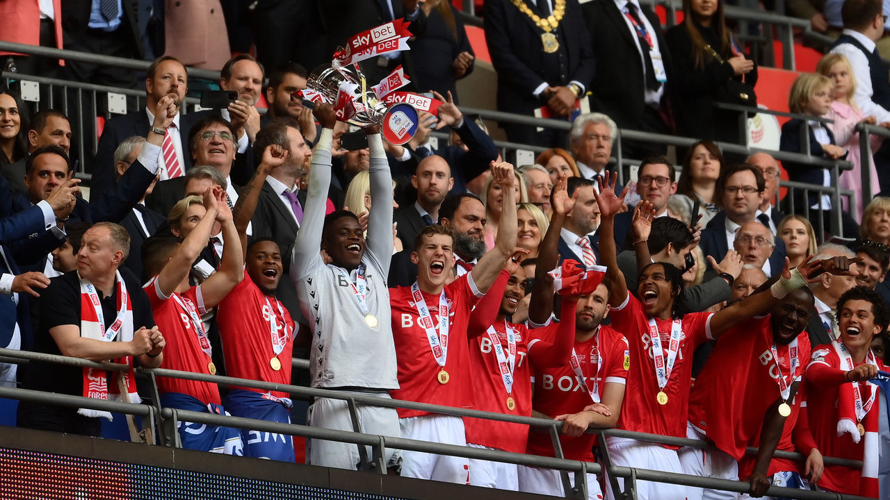 LONDON, ENGLAND - MAY 29: Brice Samba of Nottingham Forest lifts the trophy following their sides victory in the Sky Bet Championship Play-Off Final match between Huddersfield Town and Nottingham Forest at Wembley Stadium on May 29, 2022 in London, England.
