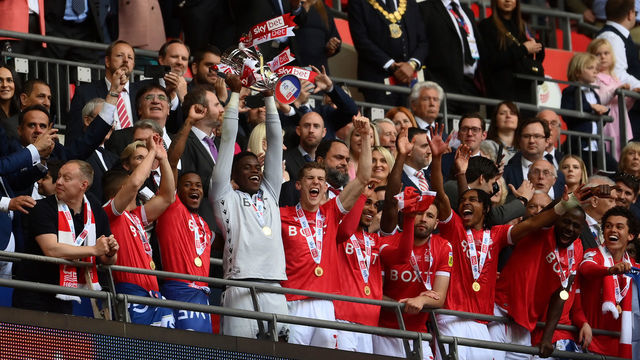 LONDON, ENGLAND - MAY 29: Brice Samba of Nottingham Forest lifts the trophy following their sides victory in the Sky Bet Championship Play-Off Final match between Huddersfield Town and Nottingham Forest at Wembley Stadium on May 29, 2022 in London, England.