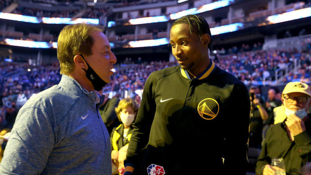 SAN FRANCISCO, CA - FEBRUARY 16: Golden State Warriors majority owner Joe Lacob, left, talks with Golden State Warriors rookie Jonathan Kuminga (00) before the tipoff against the Denver Nuggets at Chase Center in San Francisco, Calif., on Wednesday, Feb. 16, 2022.