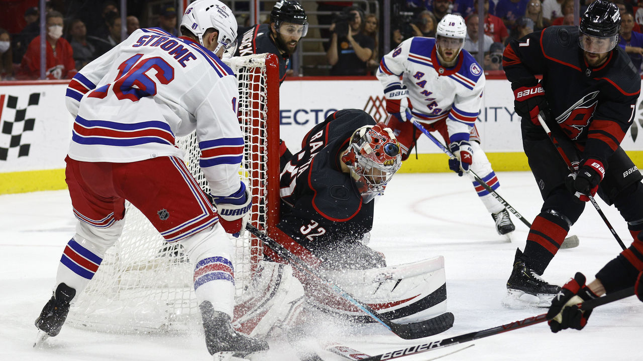 RALEIGH, NORTH CAROLINA - MAY 30: Antti Raanta #32 of the Carolina Hurricanes makes a first period save against Ryan Strome #16 of the New York Rangers in Game Seven of the Second Round of the 2022 Stanley Cup Playoffs at PNC Arena on May 30, 2022 in Raleigh, North Carolina.