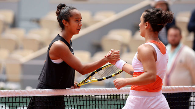 PARIS, FRANCE - MAY 31: Martina Trevisan of Italy interacts with Leylah Fernandez of Canada after winning their Women's Singles Quarter Final match on Day 10 of The 2022 French Open at Roland Garros on May 31, 2022 in Paris, France.