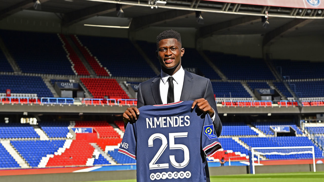 PARIS, FRANCE - SEPTEMBER 09: Nuno Mendes poses with his new jersey inside Parc des Princes on September 09, 2021 in Paris, France.