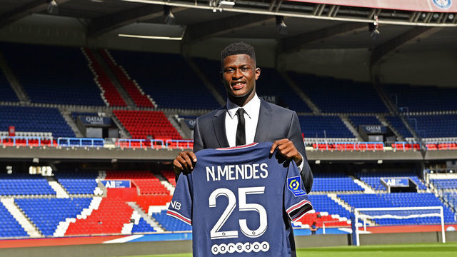PARIS, FRANCE - SEPTEMBER 09: Nuno Mendes poses with his new jersey inside Parc des Princes on September 09, 2021 in Paris, France.