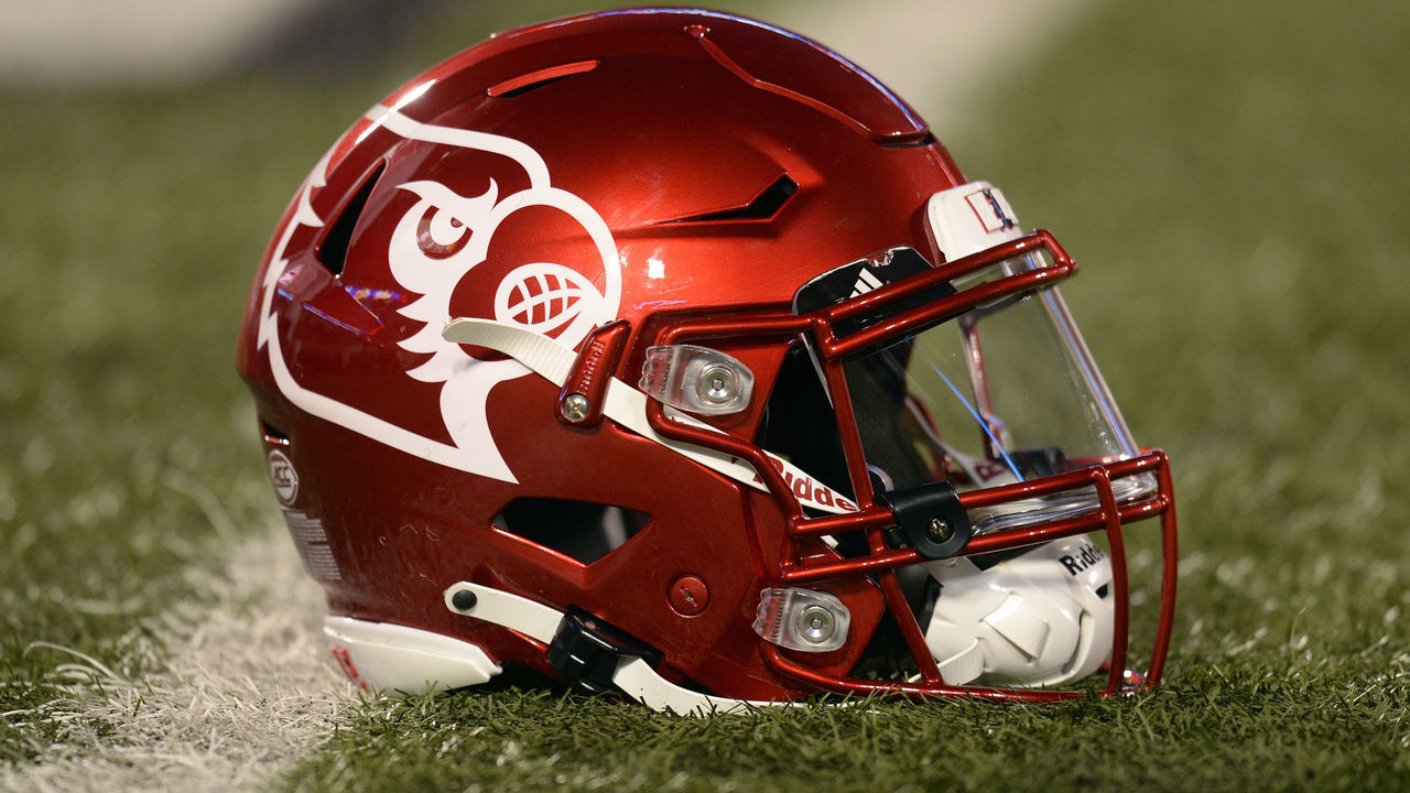 LOUISVILLE, KY - NOVEMBER 06: A Louisville Cardinals helmet sits on the field as players warm up for the college football game between the Clemson Tigers and the Louisville Cardinals on November 6, 2021, at Cardinal Stadium in Louisville, Kentucky.