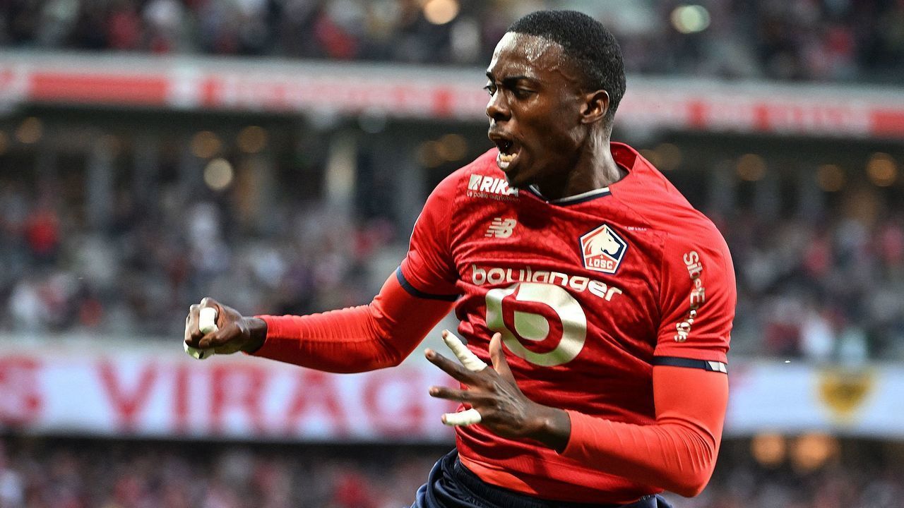 TOPSHOT - Lille's forward Timothy Weah celebrates after scoring a first goal during the French L1 football match between Lille OSC and Stade Rennais (Rennes) at Stade Pierre-Mauroy in Villeneuve-d'Asq, northern France on May 21, 2022.