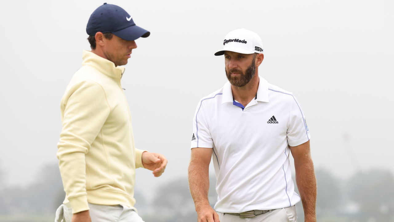 SAN DIEGO, CALIFORNIA - JUNE 18: (L-R) Rory McIlroy of Northern Ireland and Dustin Johnson of the United States paly the 13th green during the second round of the 2021 U.S. Open at Torrey Pines Golf Course (South Course) on June 18, 2021 in San Diego, California.