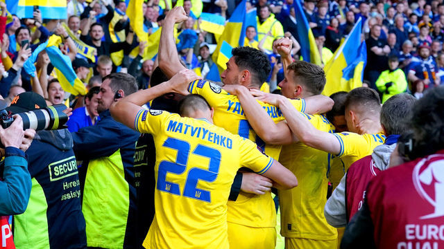 Ukraine's Roman Yaremchuk (centre) celebrates in front of the fans after scoring their side's second goal of the game during the FIFA World Cup 2022 Qualifier play-off semi-final match at Hampden Park, Glasgow. Picture date: Wednesday June 1, 2022.