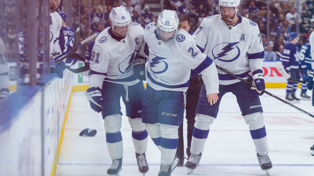 TORONTO, ON - MAY 14: Tampa Bay Lightning Center Brayden Point (21) is helped off the ice after being injured during the first period of the Round 1 NHL Stanley Cup Playoffs Game 7 between the Tampa Bay Lightning and the Toronto Maple Leafs on May 14, 2022, at Scotiabank Arena in Toronto, ON, Canada.
