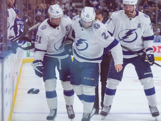 TORONTO, ON - MAY 14: Tampa Bay Lightning Center Brayden Point (21) is helped off the ice after being injured during the first period of the Round 1 NHL Stanley Cup Playoffs Game 7 between the Tampa Bay Lightning and the Toronto Maple Leafs on May 14, 2022, at Scotiabank Arena in Toronto, ON, Canada.