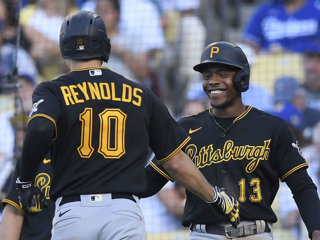 LOS ANGELES, CA - JUNE 01: Bryan Reynolds #10 of the Pittsburgh Pirates celebrates his two-run home run with Ke'Bryan Hayes #13 against starting pitcher Mitch White of the Los Angeles Dodgers in the fifth inning at Dodger Stadium on June 1, 2022 in Los Angeles, California.
