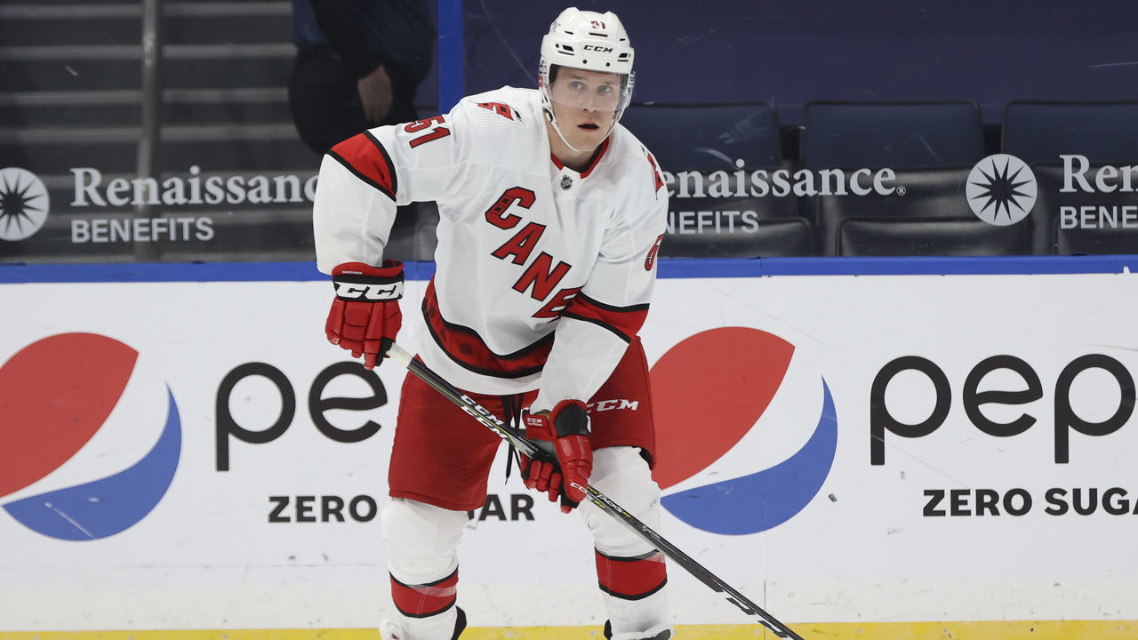 TAMPA, FL - FEBRUARY 24: Carolina Hurricanes defenseman Jake Gardiner (51) skates with the puck during the NHL game between the Carolina Hurricanes and Tampa Bay Lightning on February 24, 2021 at Amalie Arena in Tampa, FL.