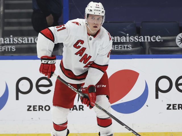 TAMPA, FL - FEBRUARY 24: Carolina Hurricanes defenseman Jake Gardiner (51) skates with the puck during the NHL game between the Carolina Hurricanes and Tampa Bay Lightning on February 24, 2021 at Amalie Arena in Tampa, FL.