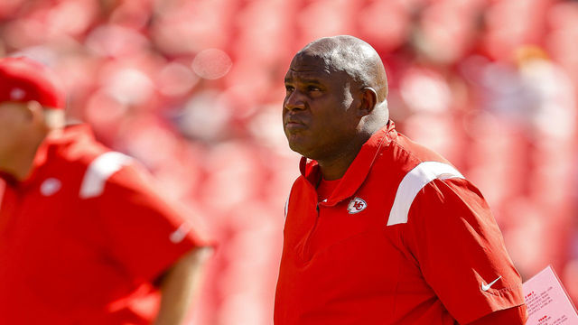 KANSAS CITY, MO - SEPTEMBER 26: Kansas City Chiefs offensive coordinator Eric Bieniemy, right, watches pregame warmups as head coach Andy Reid, left, looks on prior to the game against the Los Angeles Chargers at Arrowhead Stadium on September 26, 2021 in Kansas City, Missouri.