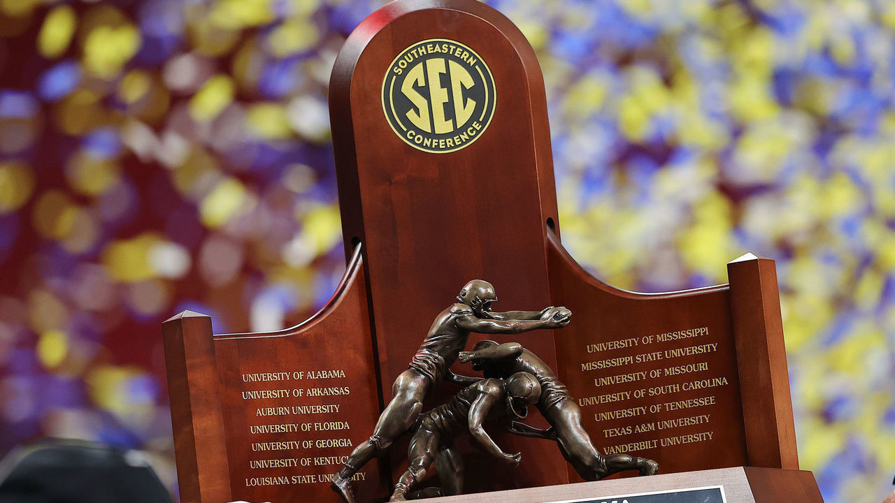 ATLANTA, GEORGIA - DECEMBER 04: The SEC Championship trophy is held after the Alabama Crimson Tide beat the Georgia Bulldogs in the SEC Championship game at Mercedes-Benz Stadium on December 04, 2021 in Atlanta, Georgia.