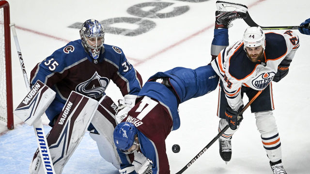 DENVER, CO - MAY 31: Zack Kassian (44) of the Edmonton Oilers upends Bowen Byram (4) of the Colorado Avalanche as Darcy Kuemper (35) tends the net during the second period at Ball Arena on Monday, May 31, 2022. The Avalanche hosted the Oilers in Game one of the best-of-seven Western Conference Finals.