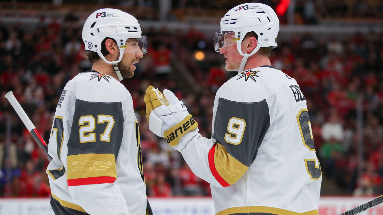 CHICAGO, IL - APRIL 27: Vegas Golden Knights defenseman Shea Theodore (27) and Vegas Golden Knights center Jack Eichel (9) chat during the overtime period during a game between the Vegas Golden Knights and the Chicago Blackhawks on April 27, 2022 at the United Center in Chicago, IL.