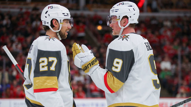 CHICAGO, IL - APRIL 27: Vegas Golden Knights defenseman Shea Theodore (27) and Vegas Golden Knights center Jack Eichel (9) chat during the overtime period during a game between the Vegas Golden Knights and the Chicago Blackhawks on April 27, 2022 at the United Center in Chicago, IL.