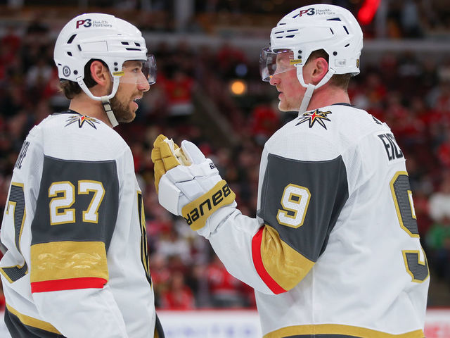 CHICAGO, IL - APRIL 27: Vegas Golden Knights defenseman Shea Theodore (27) and Vegas Golden Knights center Jack Eichel (9) chat during the overtime period during a game between the Vegas Golden Knights and the Chicago Blackhawks on April 27, 2022 at the United Center in Chicago, IL.