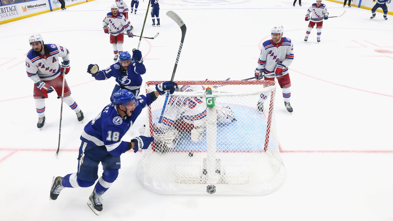 TAMPA, FLORIDA - JUNE 05: Ondrej Palat #18 of the Tampa Bay Lightning celebrates scoring the game-winning goal past Igor Shesterkin #31 of the New York Rangers as he is joined by Steven Stamkos #91 in Game Three of the Eastern Conference Final of the 2022 Stanley Cup Playoffs at Amalie Arena on June 05, 2022 in Tampa, Florida.