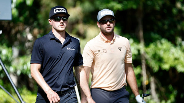 HILTON HEAD ISLAND, SOUTH CAROLINA - APRIL 15: Mackenzie Hughes of Canada (L) and Corey Conners of Canada walk off the 12th tee during the second round of the RBC Heritage at Harbor Town Golf Links on April 15, 2022 in Hilton Head Island, South Carolina.