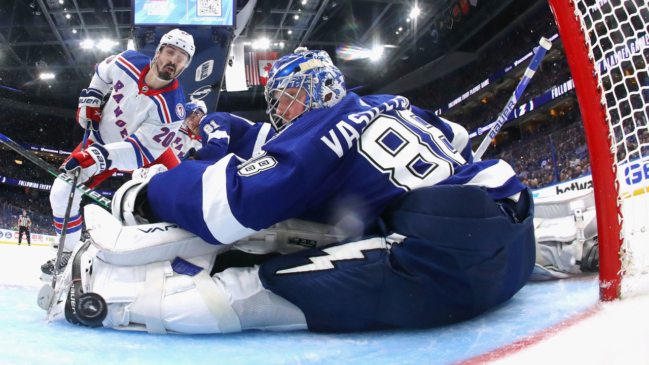 TAMPA, FLORIDA - JUNE 05: Chris Kreider #20 of the New York Rangers scores a power play goal past Andrei Vasilevskiy #88 of the Tampa Bay Lightning assisted by Artemi Panarin and Mika Zibanejad in Game Three of the Eastern Conference Final of the 2022 Stanley Cup Playoffs against the Tampa Bay Lightning at Amalie Arena on June 05, 2022 in Tampa, Florida. The Lightning defeated the Rangers 3-2.