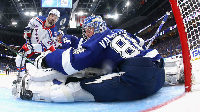 TAMPA, FLORIDA - JUNE 05: Chris Kreider #20 of the New York Rangers scores a power play goal past Andrei Vasilevskiy #88 of the Tampa Bay Lightning assisted by Artemi Panarin and Mika Zibanejad in Game Three of the Eastern Conference Final of the 2022 Stanley Cup Playoffs against the Tampa Bay Lightning at Amalie Arena on June 05, 2022 in Tampa, Florida. The Lightning defeated the Rangers 3-2.