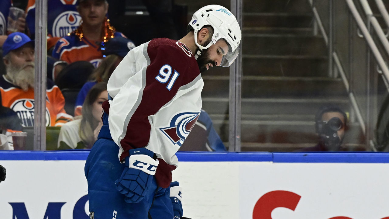 EDMONTON, ALBERTA - JUNE 04: A Colorado Avalanche trainer follows Colorado Avalanche center Nazem Kadri (91) down on the ice after a hit by Edmonton Oilers left wing Evander Kane (91) in the first period during game three of the NHL Stanley Cup Western Conference Finals at Rogers Place June 04, 2022. Kadri left the game, Kane got a five-minute major.