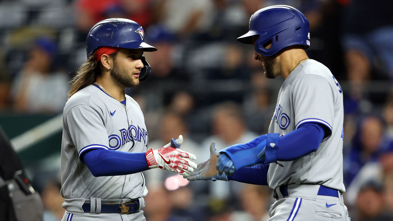 KANSAS CITY, MISSOURI - JUNE 06: Bo Bichette #11 of the Toronto Blue Jays is congratulated by George Springer #4 after hitting a two-run home run during the 4th inning of the game against the Kansas City Royals at Kauffman Stadium on June 06, 2022 in Kansas City, Missouri.