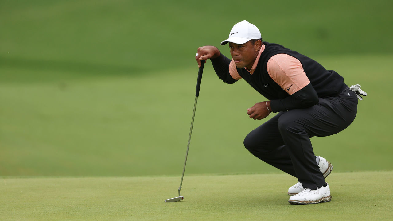 TULSA, OKLAHOMA - MAY 21: Tiger Woods of the United States lines up a putt on the 15th green during the third round of the 2022 PGA Championship at Southern Hills Country Club on May 21, 2022 in Tulsa, Oklahoma.