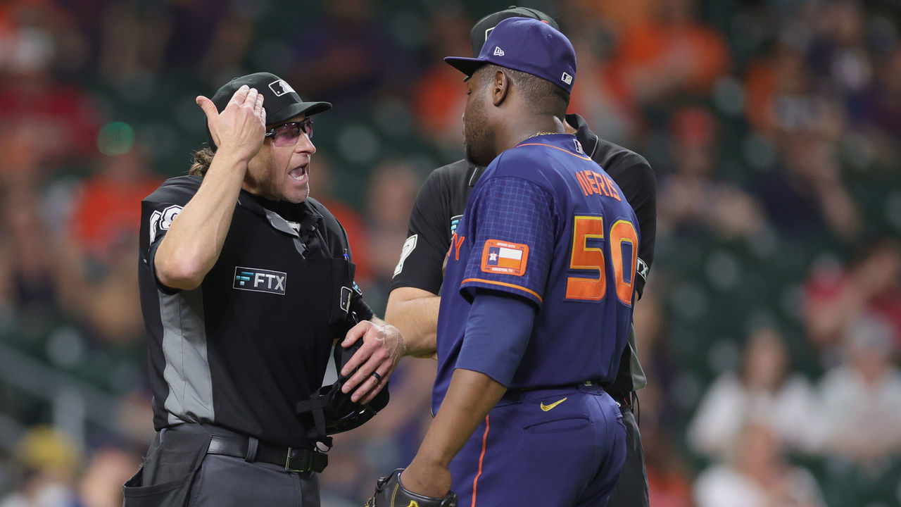HOUSTON, TEXAS - JUNE 06: Hector Neris #50 of the Houston Astros is ejected by umpire Chris Guccione #68 in the ninth inning for throwing at the head of Eugenio Suarez #28 of the Seattle Mariners at Minute Maid Park on June 06, 2022 in Houston, Texas.