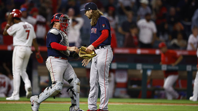 ANAHEIM, CALIFORNIA - JUNE 07: Christian Vazquez #7 of the Boston Red Sox celebrates a 6-5 win with Matt Strahm #55 against the Los Angeles Angels at Angel Stadium of Anaheim on June 07, 2022 in Anaheim, California.