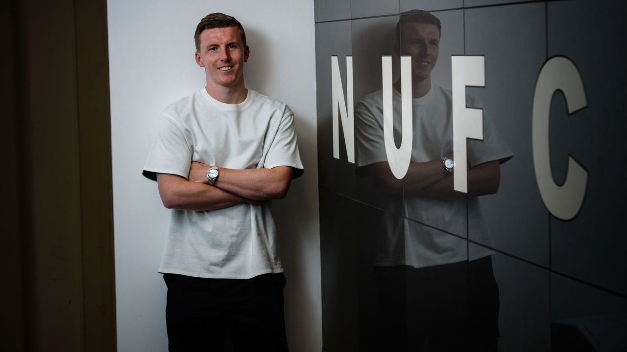 NEWCASTLE UPON TYNE, ENGLAND - JUNE 08: Matt Targett poses for photographs after signing a new permanent move to St. James Park on June 08, 2022 in Newcastle upon Tyne, England.