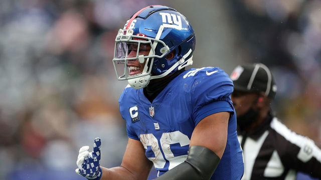 EAST RUTHERFORD, NEW JERSEY - JANUARY 09: Saquon Barkley #26 of the New York Giants reacts in the third quarter of the game against the Washington Football Team at MetLife Stadium on January 09, 2022 in East Rutherford, New Jersey.