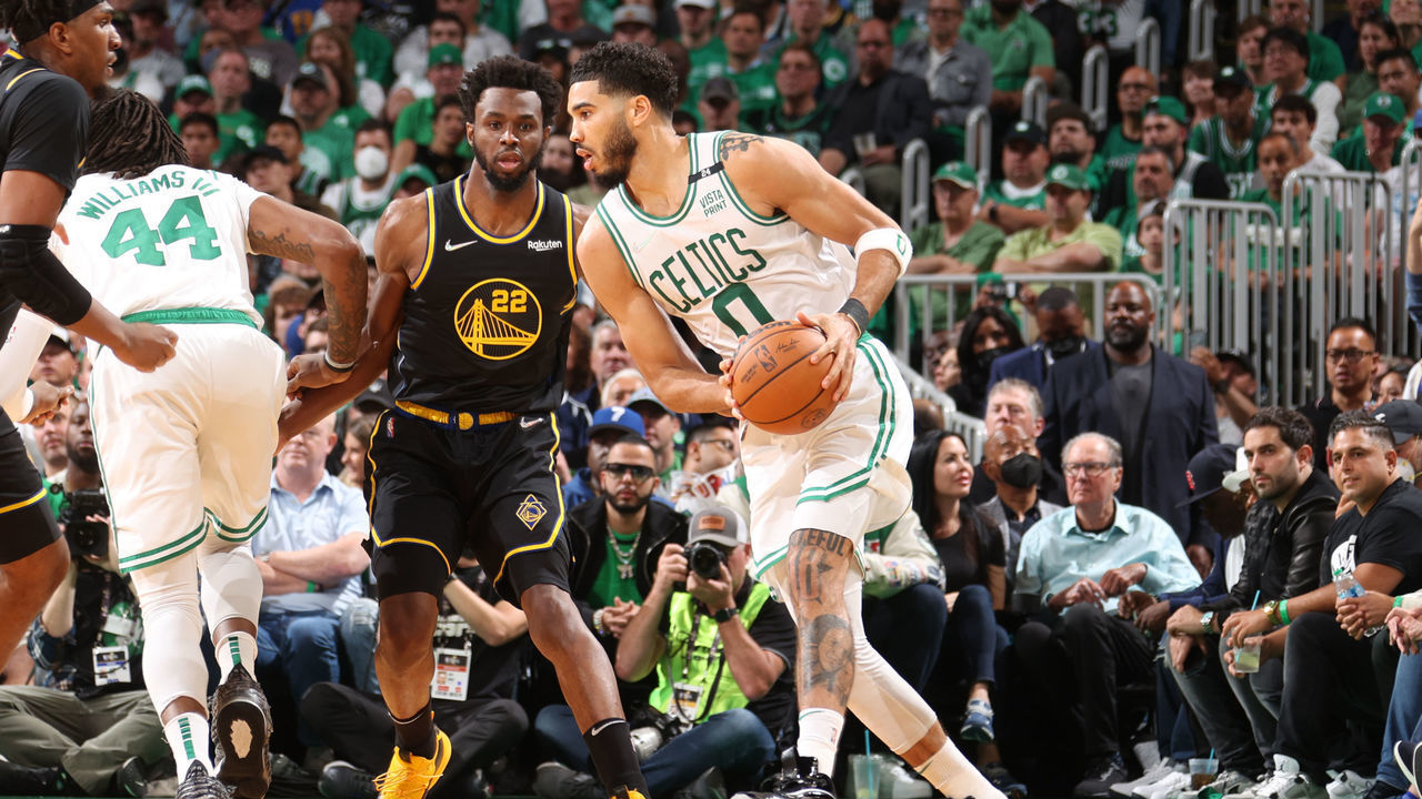 BOSTON, MA - JUNE 8: Kevon Looney #5 and Andrew Wiggins #22 of the Golden State Warriors play defense on Jayson Tatum #0 of the Boston Celtics during Game Three of the 2022 NBA Finals on June 8, 2022 at TD Garden in Boston, Massachusetts. NOTE TO USER: User expressly acknowledges and agrees that, by downloading and or using this photograph, user is consenting to the terms and conditions of Getty Images License Agreement. Mandatory Copyright Notice: Copyright 2022 NBAE