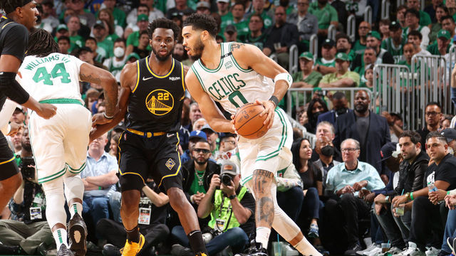 BOSTON, MA - JUNE 8: Kevon Looney #5 and Andrew Wiggins #22 of the Golden State Warriors play defense on Jayson Tatum #0 of the Boston Celtics during Game Three of the 2022 NBA Finals on June 8, 2022 at TD Garden in Boston, Massachusetts. NOTE TO USER: User expressly acknowledges and agrees that, by downloading and or using this photograph, user is consenting to the terms and conditions of Getty Images License Agreement. Mandatory Copyright Notice: Copyright 2022 NBAE