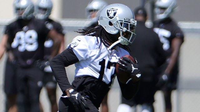 HENDERSON, NEVADA - JUNE 07: Wide receiver Davante Adams #17 of the Las Vegas Raiders runs with the ball during mandatory minicamp at the Las Vegas Raiders Headquarters/Intermountain Healthcare Performance Center on June 07, 2022 in Henderson, Nevada.
