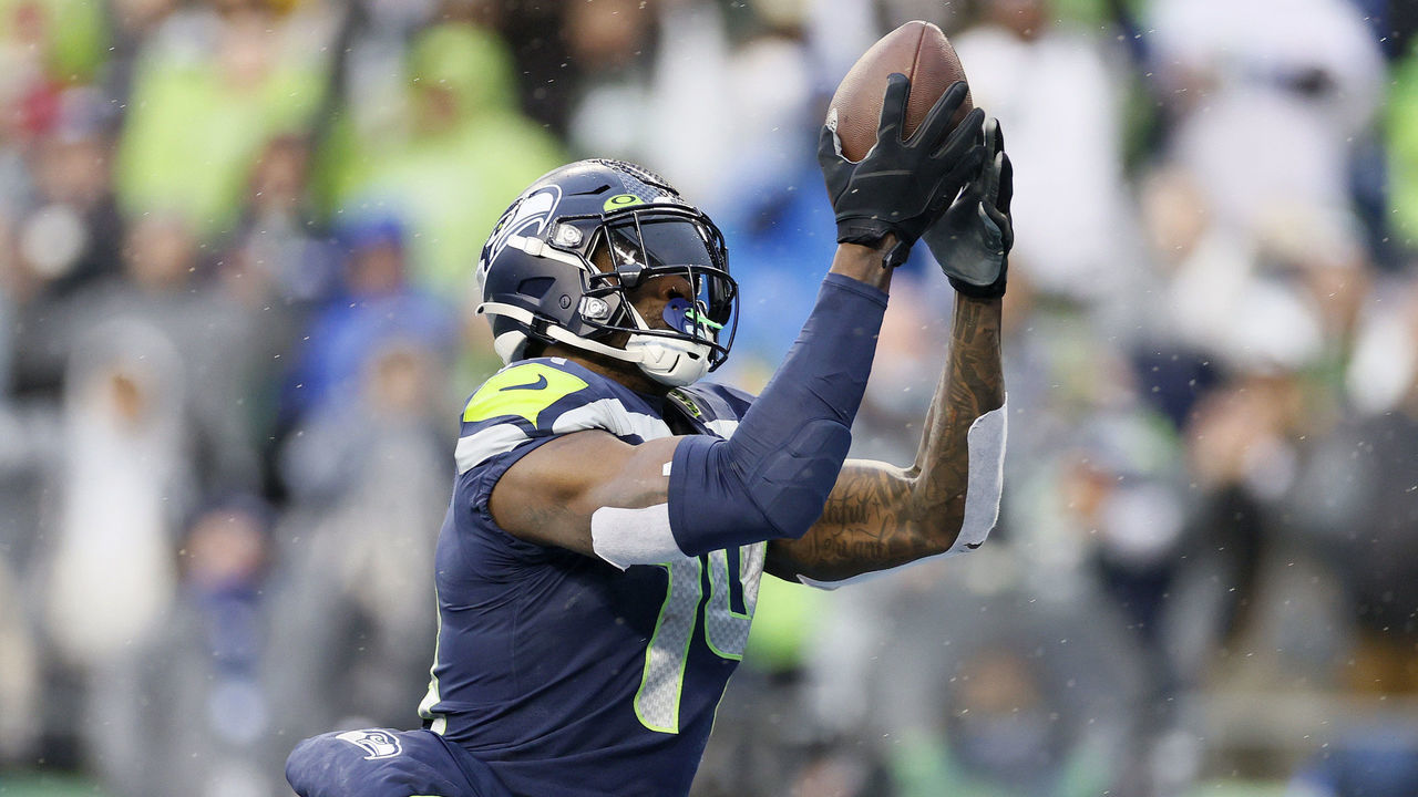 SEATTLE, WASHINGTON - JANUARY 02: DK Metcalf #14 of the Seattle Seahawks catches a pass for a touchdown against the Detroit Lions during the first half at Lumen Field on January 02, 2022 in Seattle, Washington.